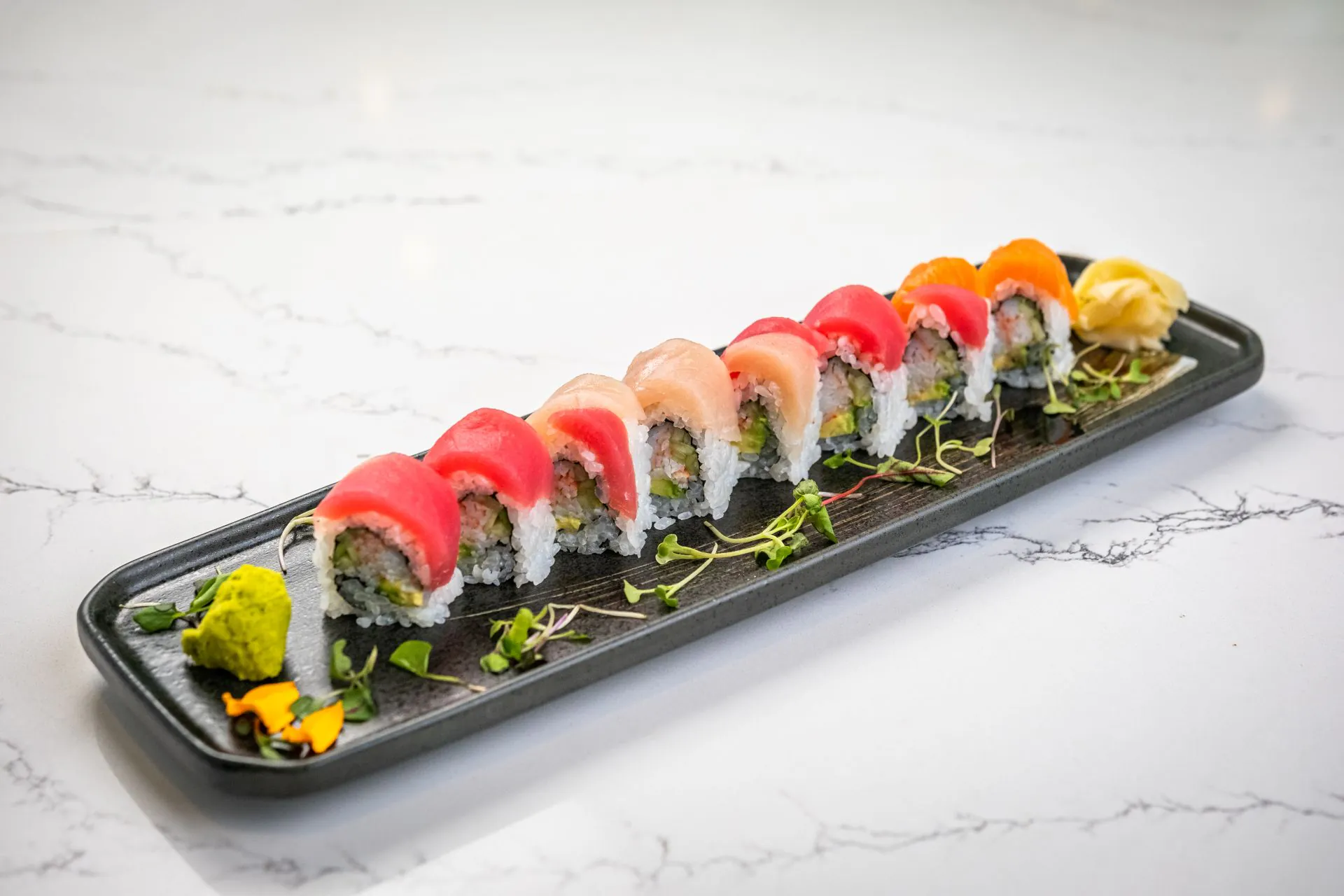 Tuna, white fish and salmon nigiri with maki rolls at Toki Ramen & Sushi, a Japanese Restaurant in Denver